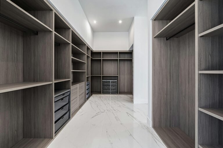 Elegant walk-in closet with ample shelving and storage in a modern design.