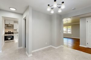 Bright and stylishly renovated home interior featuring modern lighting and open spaces.